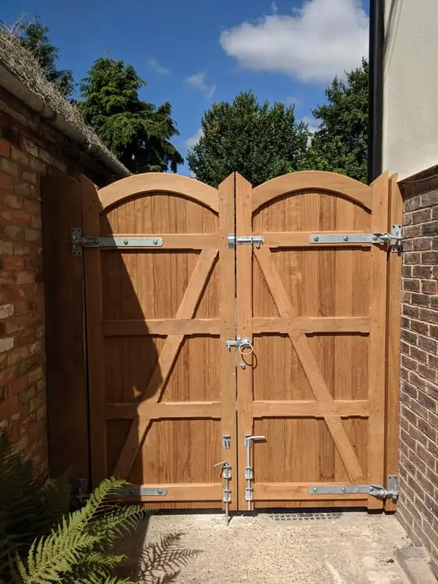Pair of arched timber side gates, made by Tyrrells