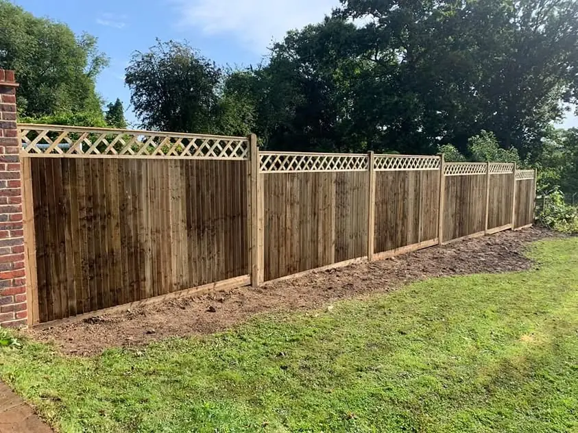 Closeboard fence with diamond trellis topper, fitted by Tyrrells